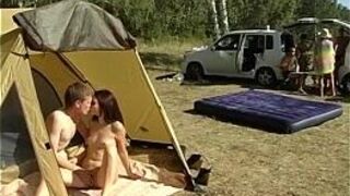 Lewd couple of naked students fucking in the tent - porn video